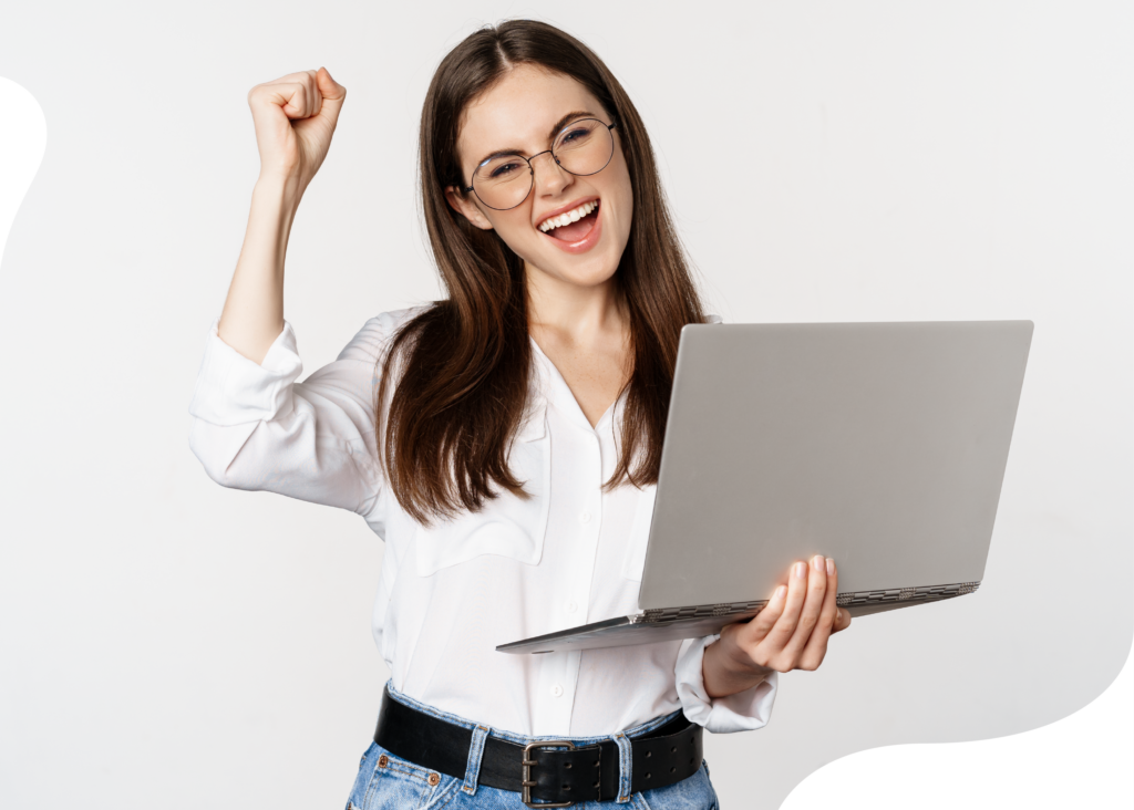 Student happy while holding a laptop she is using to take online course